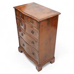 Georgian design yew wood serpentine chest, moulded and crossbanded top over two short and three long graduating cock-beaded drawers, circular pressed brass handle plates with hoop handles, fitted with slide, on bracket feet