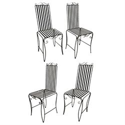 Set of four wrought-iron bloc painted strapwork garden chairs