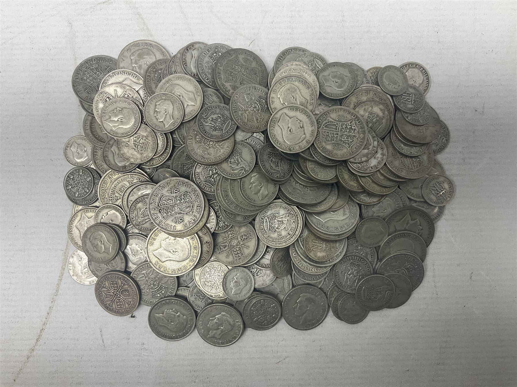 Approximately 1700 grams of Great British pre-1947 silver coins, including half crowns, two shillings / florins, shillings and sixpences