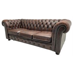 Chesterfield three-seat sofa bed upholstered in buttoned brown leather