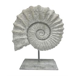 Composite Ammonite, raised on a wooden stepped plinth, H36cm