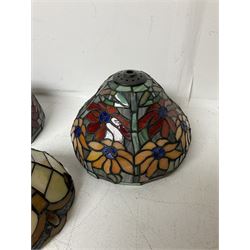 Three Tiffany style lamp shades, each with multicoloured floral decoration, largest D20.5cm