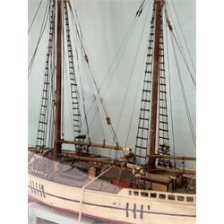 Scratch built model of a two-masted schooner, the red and white painted wooden body numbered GC-3-893, contained within wooden case, the interior painted in a light blue, with carry handle, excluding handle case H64.5cm, W67cm