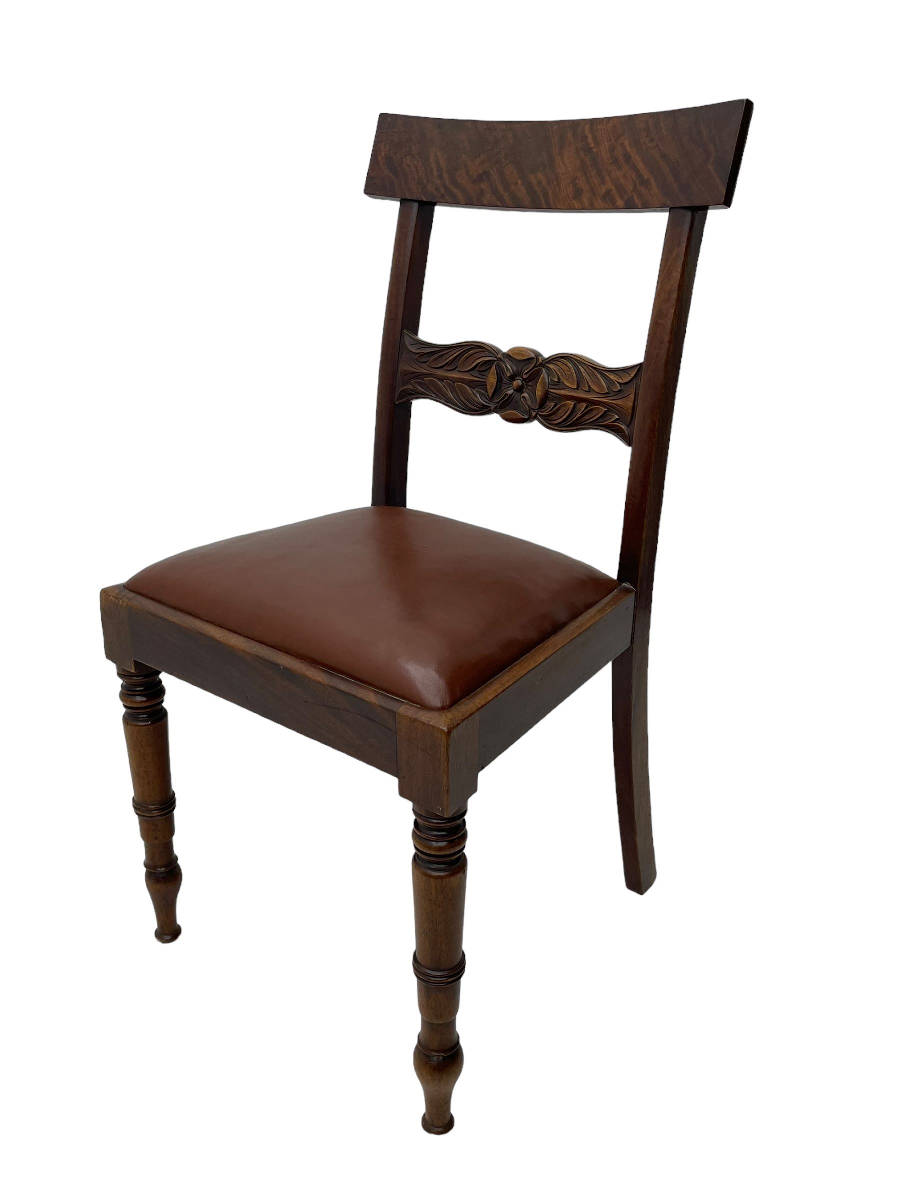 Set of six (4+2) early 19th century mahogany dining chairs, figured bar back over rose and curled leaf carved middle rail, drop-in seats upholstered in brown fabric, on turned front supports 