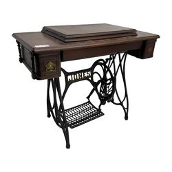 Early 20th century Jones treadle sewing machine table, bevel edged rectangular top with hinged lid enclosing sewing machine no. 480760, supported by cast iron treadle base