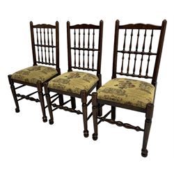 Set of six (4+2) 20th century oak spindle back dining chairs, with upholstered drop-on seat cushions, turned supports joined by turned stretchers