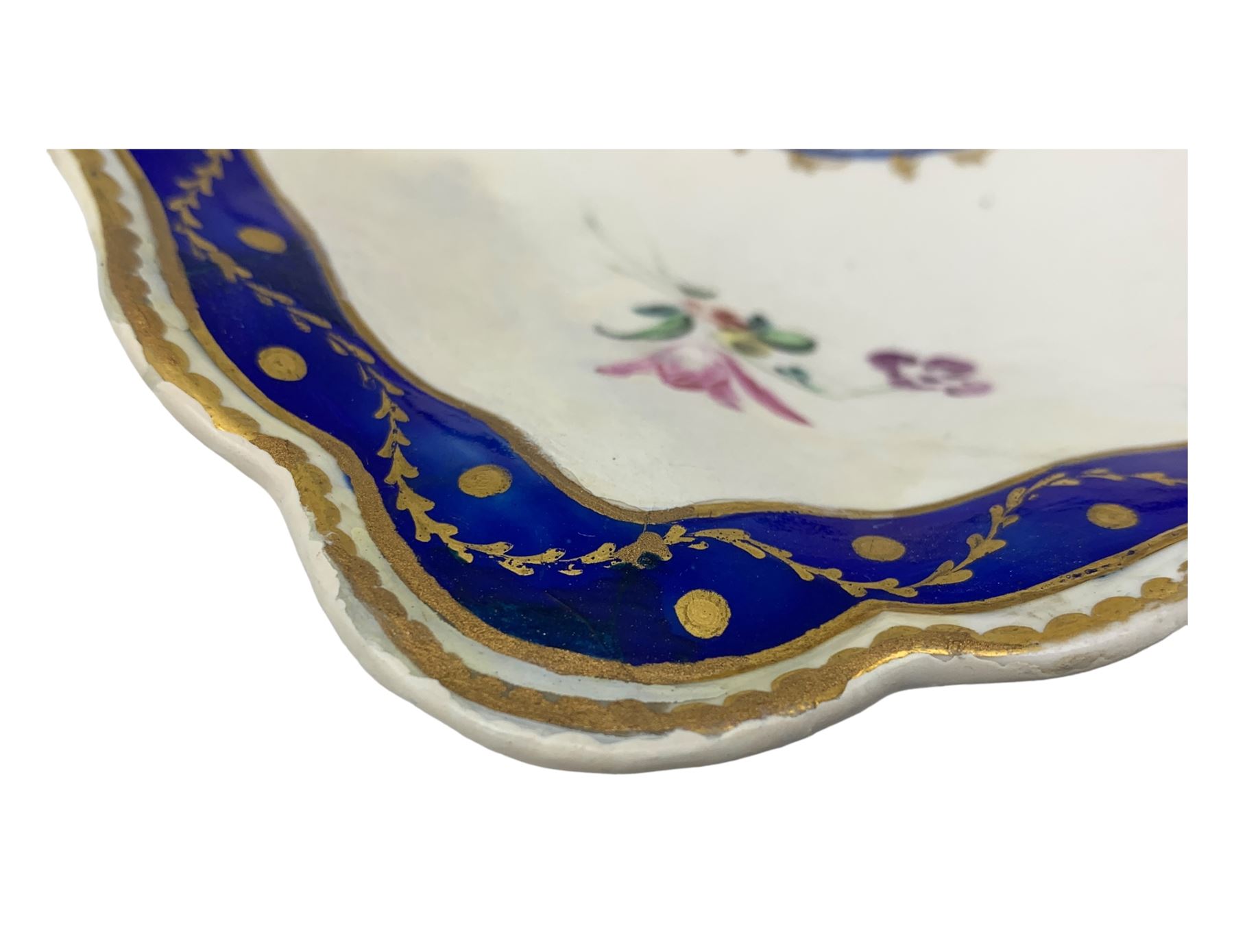 18th century Derby fluted lozenge shaped dish, in the manner of Edward Withers, painted with flower sprays within a blue and gilt leafy chain border, crown over D in blue, incised N, L26cm 