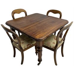 Victorian mahogany dining table, telescopic extending action, moulded rectangular top with rounded corners, single additional leaf, on turned and fluted supports with brass and ceramic castors; and a set of four Victorian mahogany dining chairs, balloon back over upholstered drop-on seat in floral pattern fabric, on turned front supports 