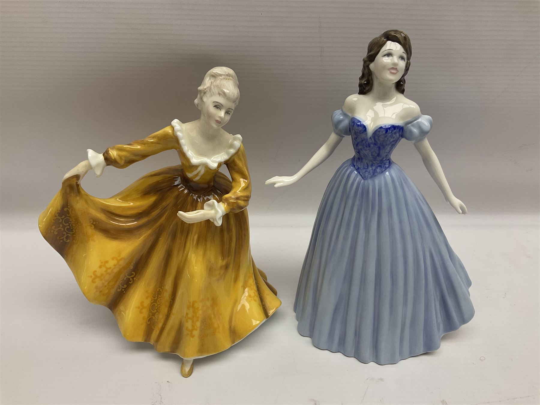 Three Royal Doulton figures, comprising Anna HN4391, Kirsty HN2381 and Deborah HN4468, together with a similar Coalport figure and ten smaller Coalport figures (14)