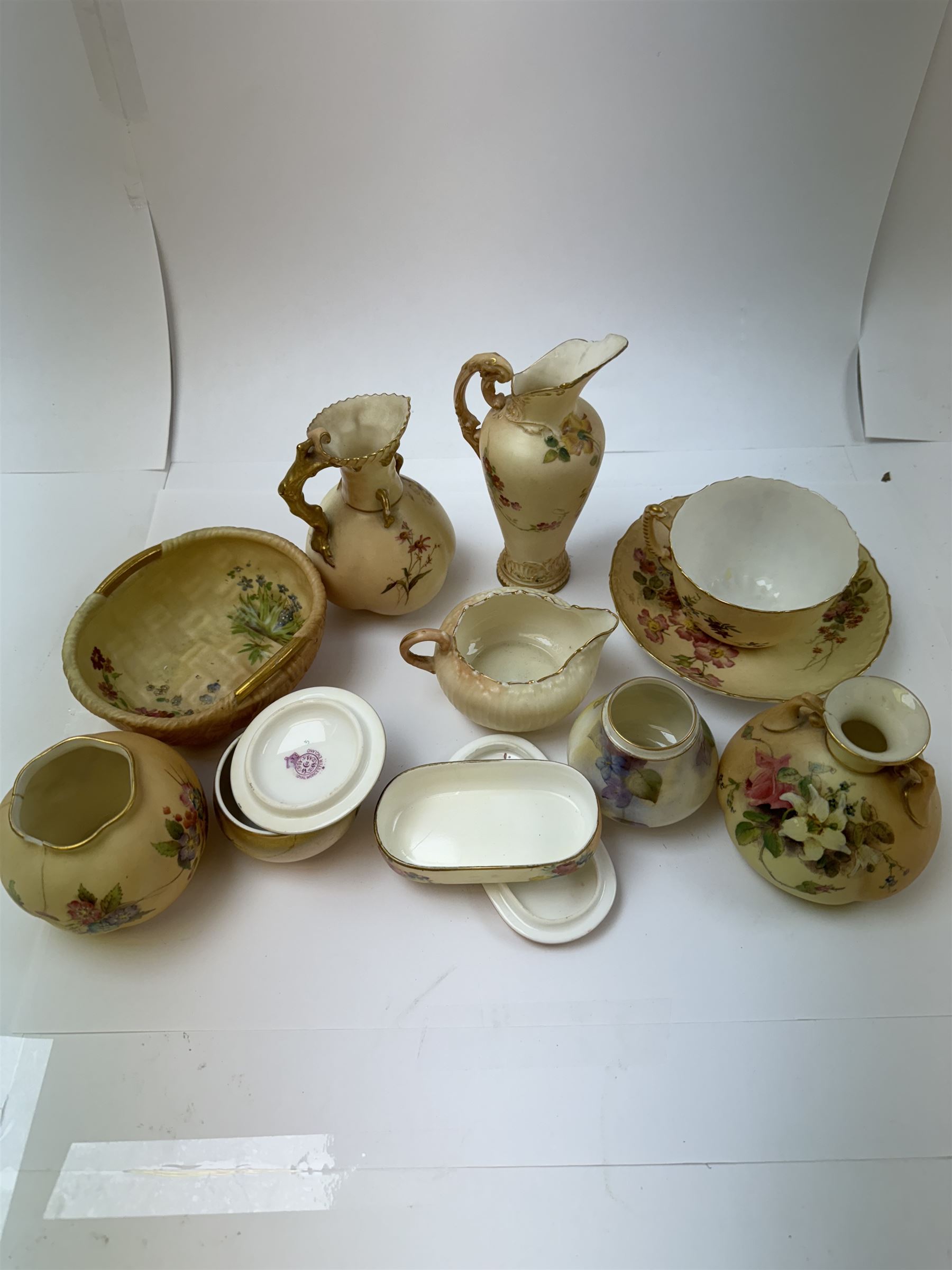 Collection of Royal Worcester ceramics, mostly blush ivory, including trinket dishes, vases, cup and saucer, etc