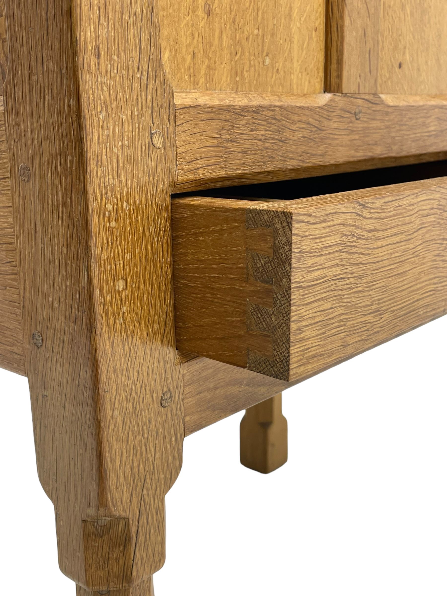 Mouseman - oak work or sewing box, rectangular adzed top inscribed 'L. M. C. 1976' enclosing vacant interior, triple panelled front and double panelled sides, fitted with single drawer, on octagonal supports, carved with mouse signature, by the workshop of Robert Thompson, Kilburn 