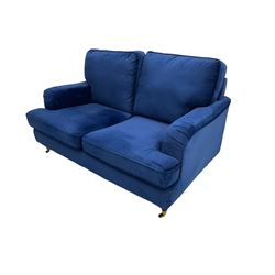 Howard design - two-seat sofa upholstered in blue fabric, traditional shape with rolled arms, on walnut finish turned feet with brushed metal cups and castors