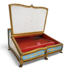 19th century French Sevres style porcelain and gilt brass table top writing box, the fall front painted with three figures in a woodland landscape, within a gilt border on a bleu celeste ground, the side panels depicting floral sprays, the top with removable porcelain inkwell and pounce pot, beaded gilt metal border with four lion paw supports and pink velvet fitted interior, L28cm x H14cm