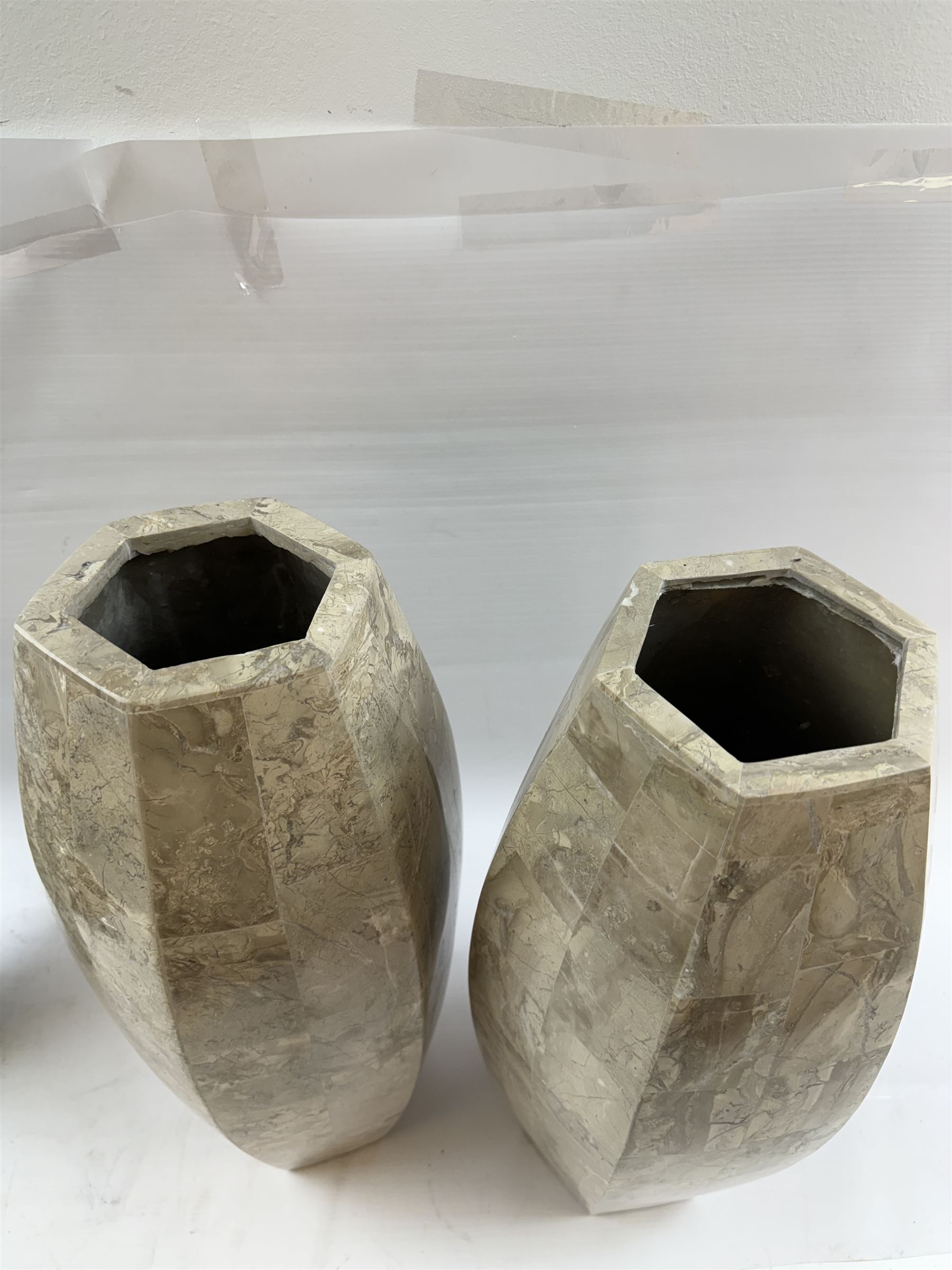 Pair of fossilised coral mosaic vases, of hexagonal form, H46cm