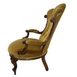 19th century walnut framed open armchair, scallop shaped back with c-scroll uprights, upholstered in yellow buttoned velvet fabric with sprung seat, arm terminals carved with acanthus leaves, raised on scrolling cabriole supports with castors