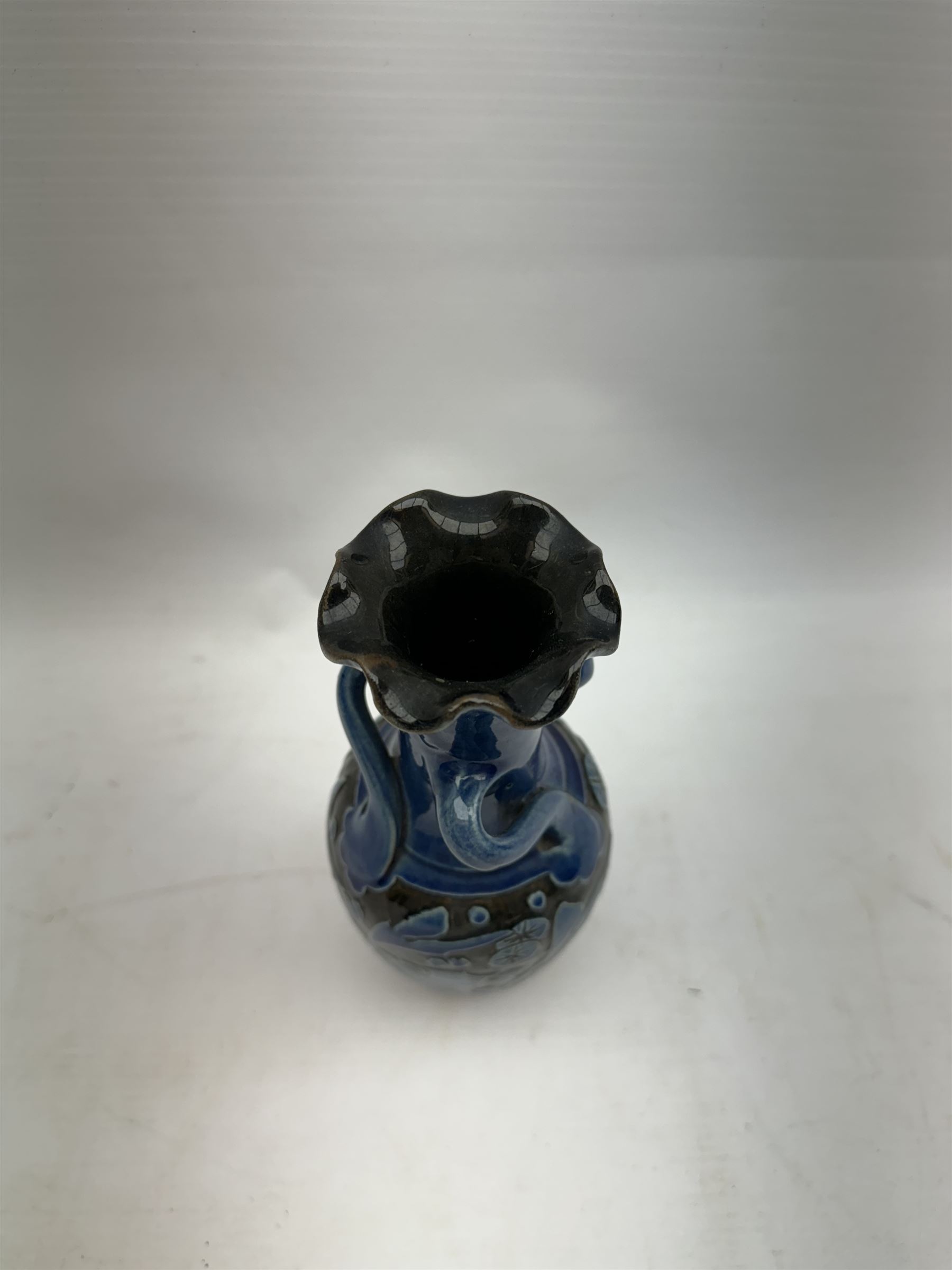 Alexander Lauder for Barum Pottery, vase of baluster form with fluted time, decorated in relief with fish upon a blue ground, H20cm