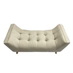 Contemporary U-shaped window or bed stool, upholstered in buttoned neutral fabric