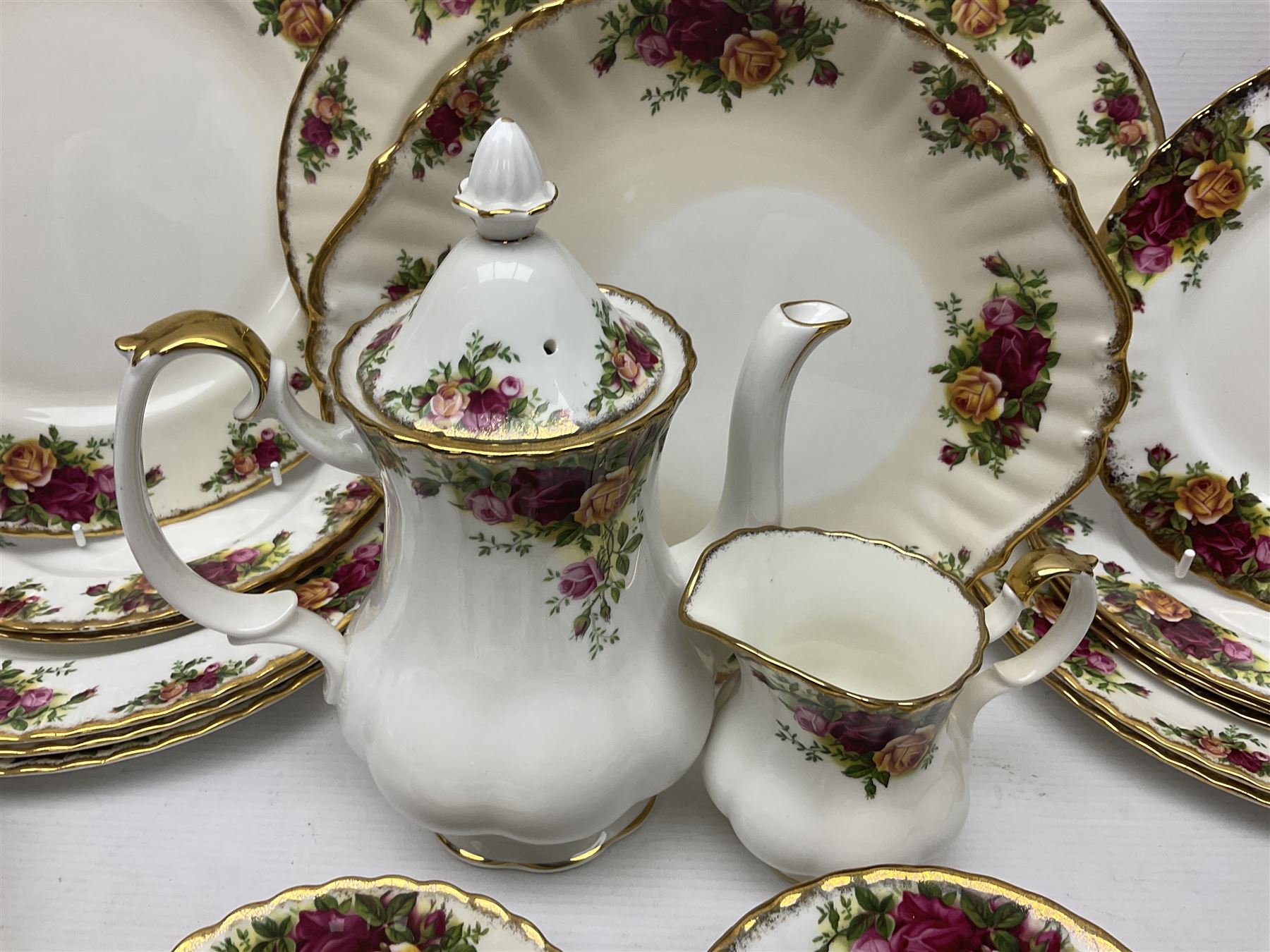 Royal Albert Old Country Roses pattern coffee set for four, comprising coffee pot, milk jug, cups and saucers, cake plate, together with six dinner plates, side plates etc (34) 