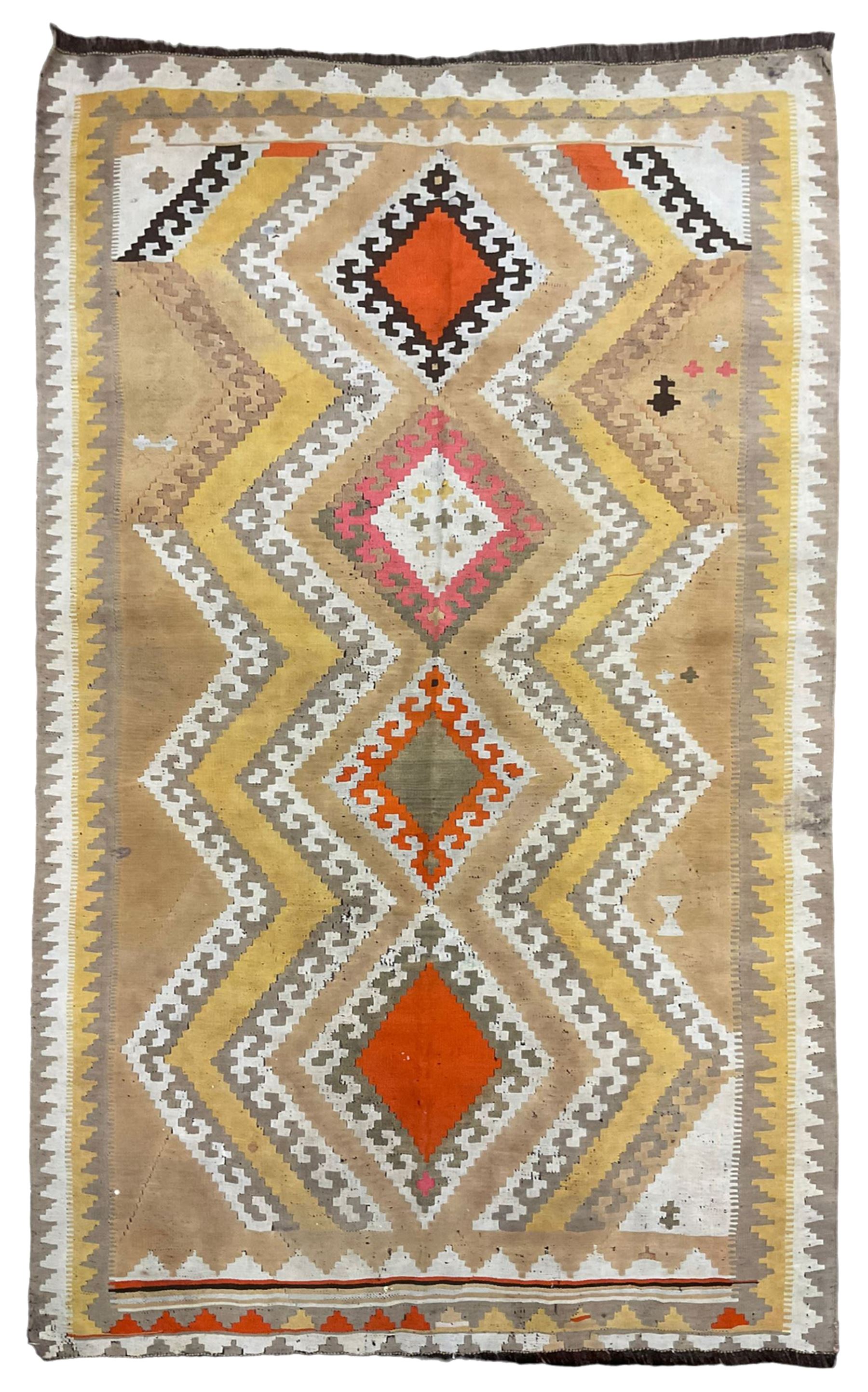 South West Persian Qashgai Kilim, mustard ground and decorated with geometric lozenges and borders 