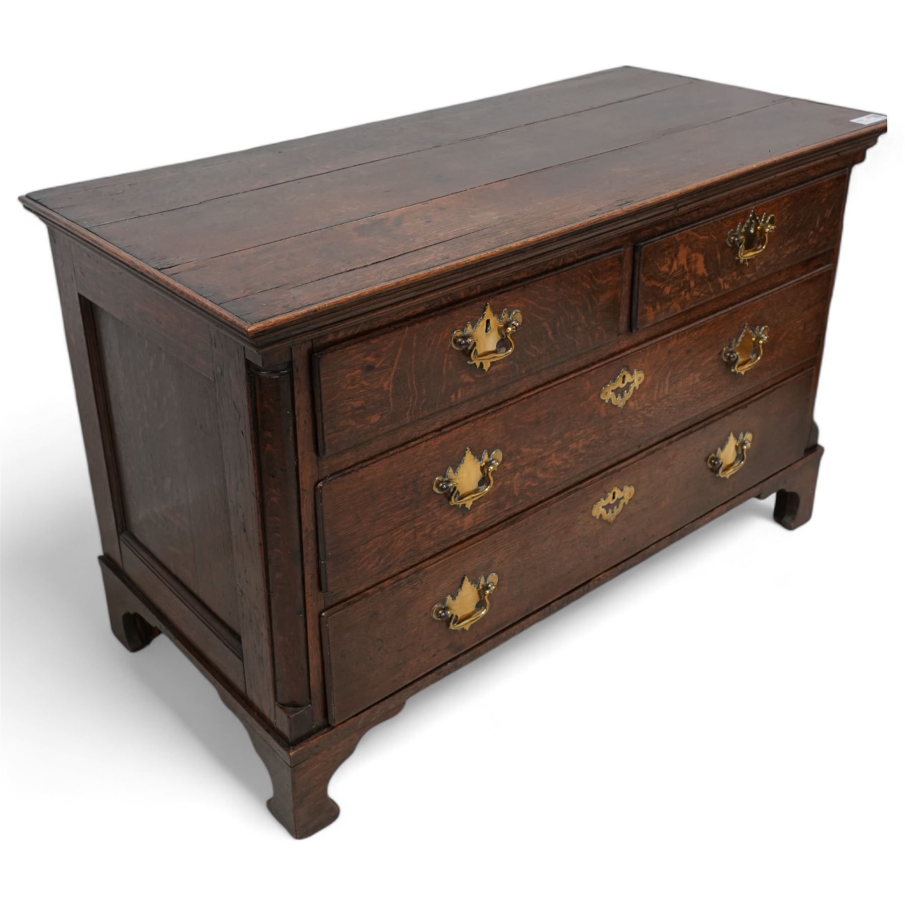 18th century oak chest, rectangular protruding top with moulded edge, fitted with two short over two long drawers, flanked by quarter-canted plain pilasters, raised on shaped bracket feet