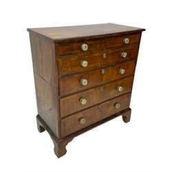 George I walnut chest, moulded rectangular top with book-matched veneers within crossbanding, fitted with two short over four long graduating drawers, moulded drawer fronts with brass handles, on bracket feet, the chest will split into two sections 