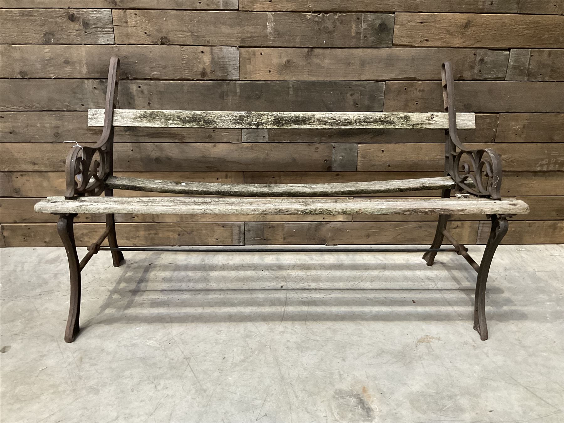 Pair of faux bois cast metal bench ends; together with wooden slatted bench with metal ends