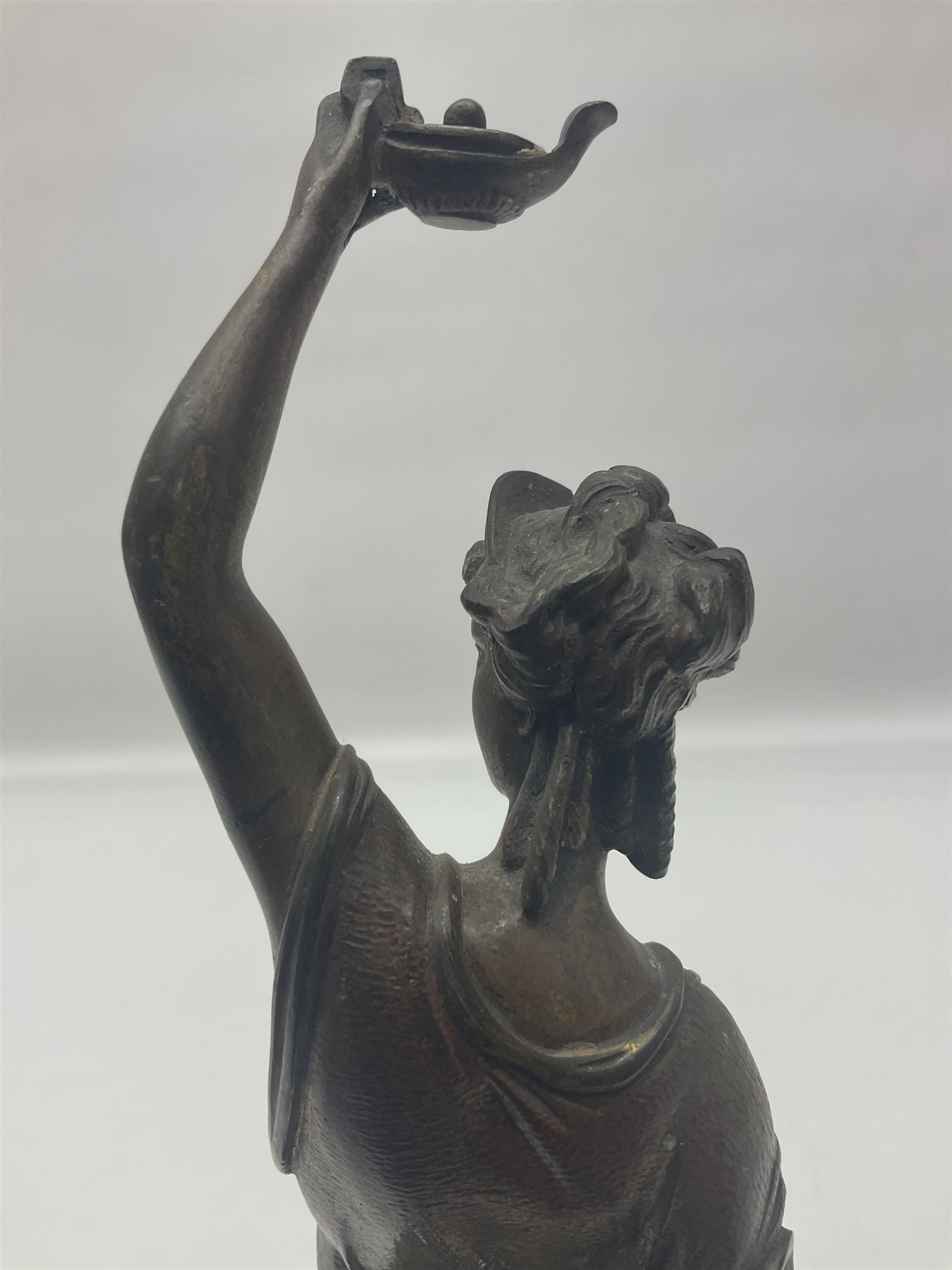 Gilt bronze figure of a lady in neo-classical dress, on a circular wooden plinth, H26cm