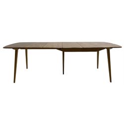 Ercol - light elm and beech 'Slide Leg Expanding Dining Table (444)', rectangular top with rounded corners, raised on tapered splayed supports, with two additional leaves