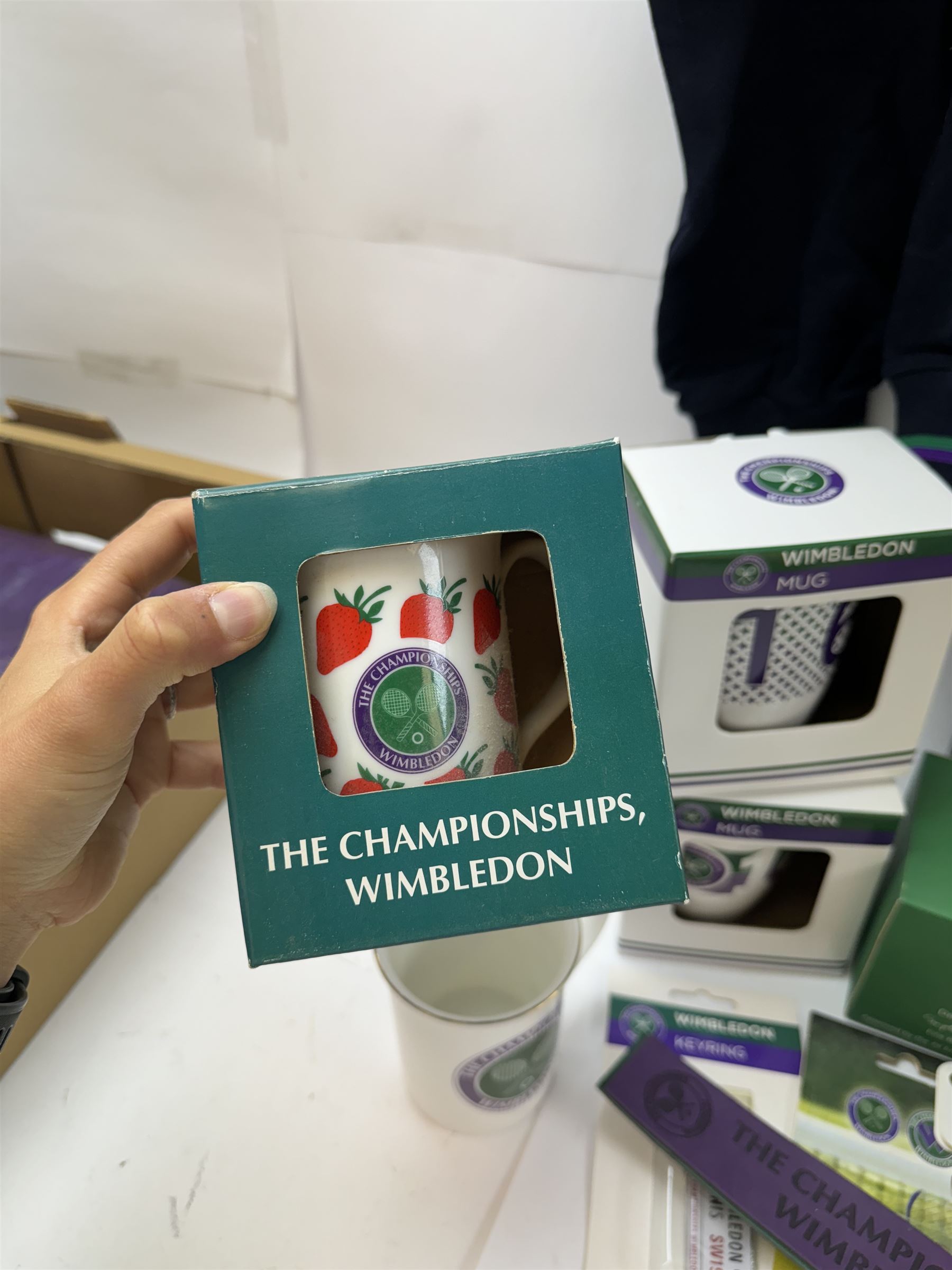 Collection of Wimbledon tennis memorabilia, including towels, programs, mugs, t-shirt, keyrings, ephemera etc