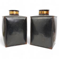 Pair of Victorian toleware shop display tea canisters and covers, numbered 1 & 2 and labelled 'Assam' and 'Green', each of rectangular section, painted with a castle and fort, within a gilt cartouche on black ground, H42cm 