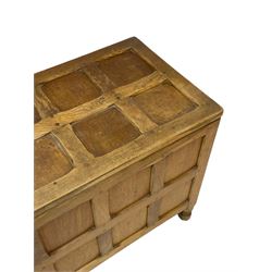 Sid Pollard (ex. Mouseman) - Yorkshire oak blanket chest, all over panelling, enclosed by hinged lid, on octagonal feet, interior plaque inscribed 'S. Pollard, Bagby, Thirsk, Yorks' 