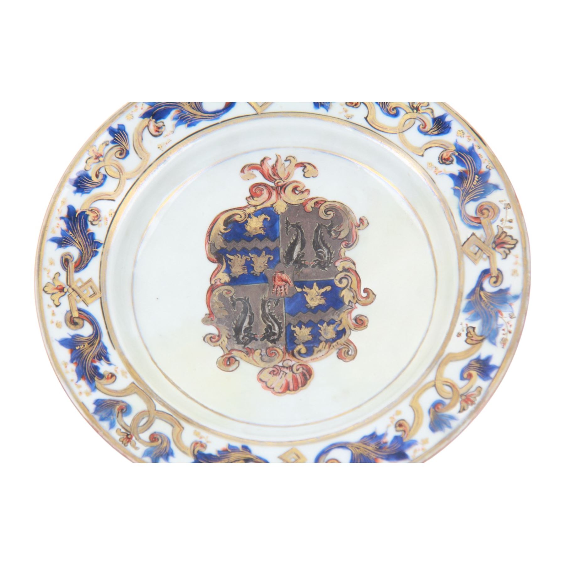 Early 18th century Chinese Imari armorial plate, circa 1720, painted with central arms of Fellowes quartering Coulson, surrounded by a European leaf scroll to the rim and heightened with gilt throughout, D22cm

Cf. Comparable pair of plates:
Lot 253, Benjamin F. Edwards III collection of Chinese Export, Christie's, 20th January 2004

Footnote: Sir John Fellowes was born in 1670, and was director and sub Governor of the South Sea Company. He became a baronet in 1719 and resided at Carshalton in Surrey. It is believed that this service would have been ordered in around 1719 or 1720

