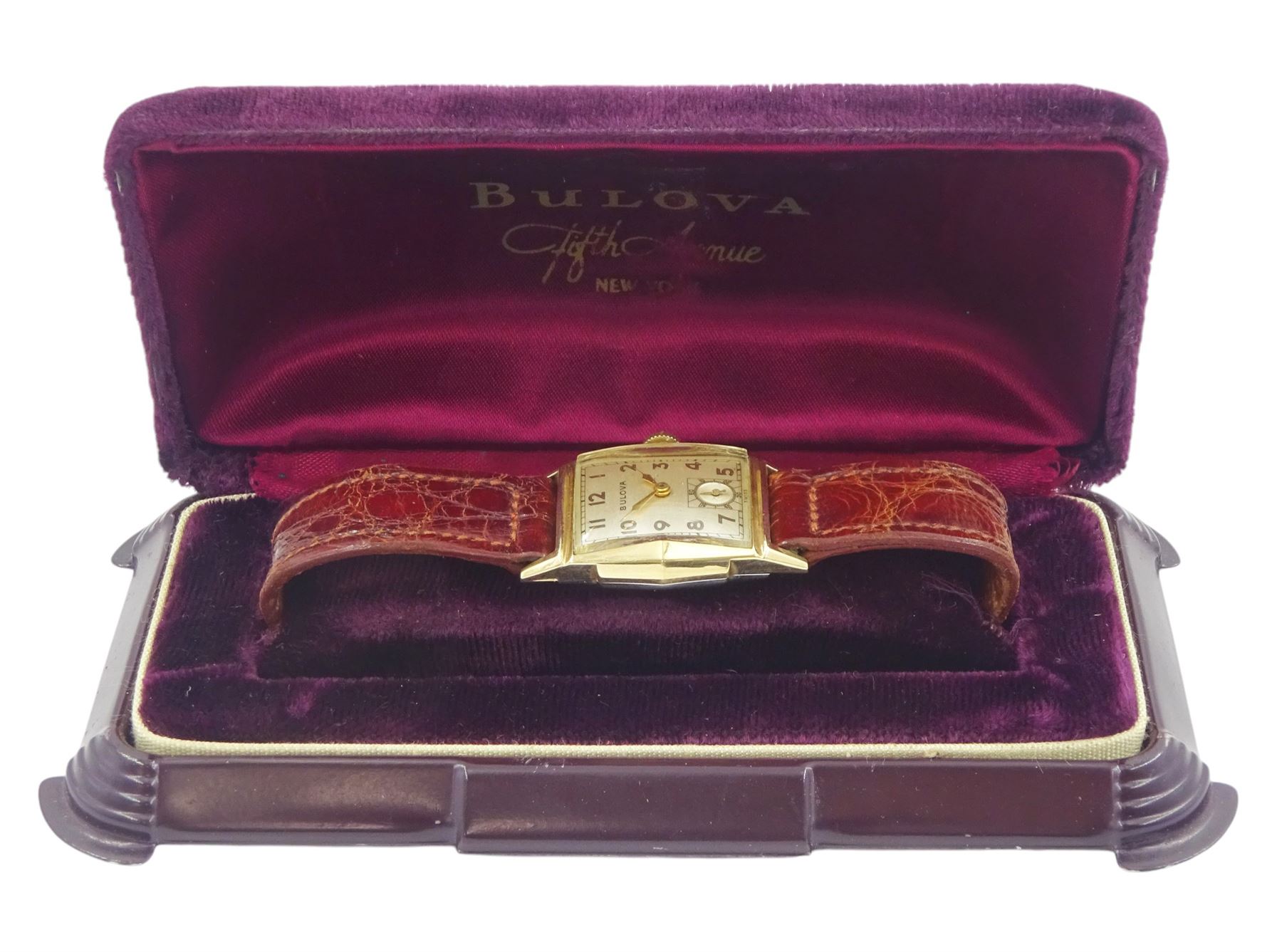 Bulova gentleman's gold-plated and stainless steel manual wind wristwatch,  silvered dial with subsidiary seconds dial, on brown leather strap, boxed