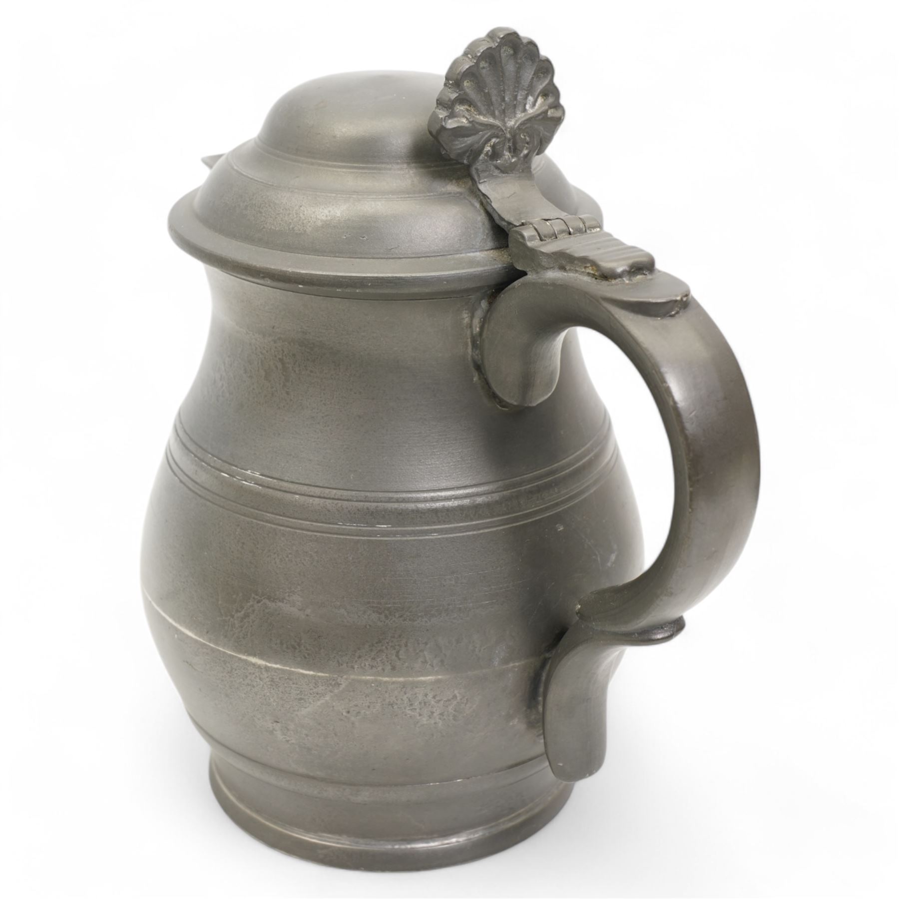 18th century pewter ale jug, circa 1790, with domed tappit lid and shell thumb piece, touch marks to base, H22cm