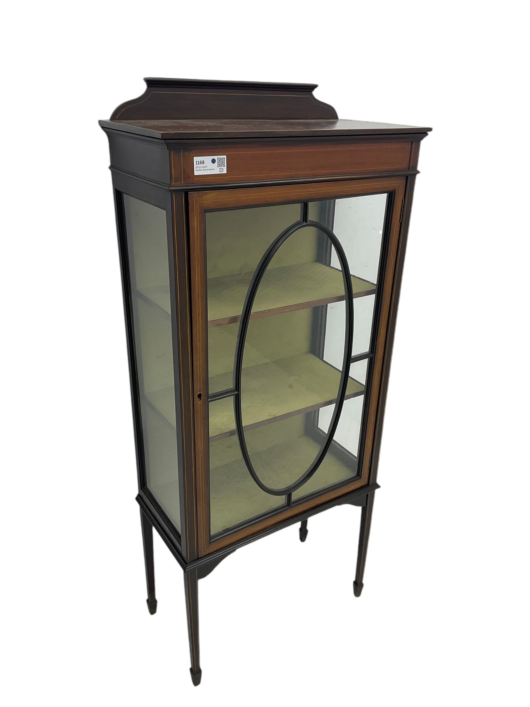 Edwardian inlaid mahogany display cabinet, shaped and raised back over single astragal glazed door, interior lined and fitted with two shelves, raised on square tapering supports