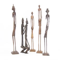 Five bronzed tribal figures, of elongated form, tallest H18cm