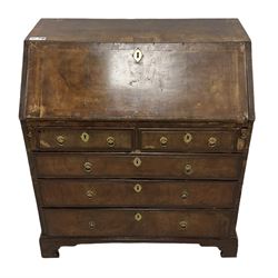 18th century walnut bureau, crossbanded and feather-banded rectangular top and fall-front, enclosing fitted interior with pigeonholes and correspondence drawers with bone handles, over two short and three long graduating drawers with moulded facias and original brass handles, on bracket feet