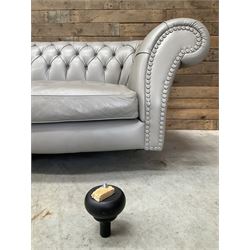 Three seat Chesterfield sofa, upholstered in grey buttoned leather - damaged leg