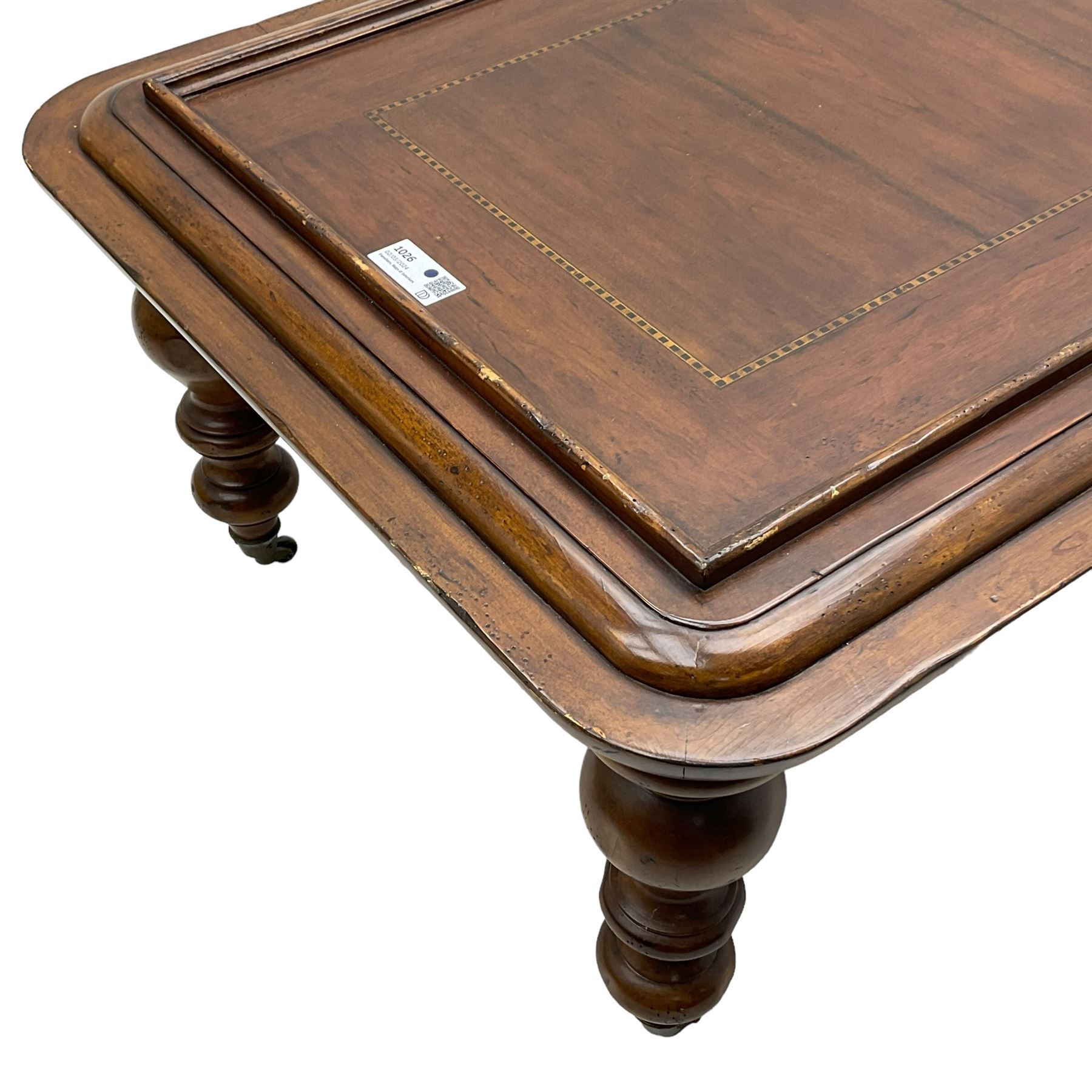 Milling Road - cherry wood coffee table, rectangular top with rounded corners, on turned feet with castors