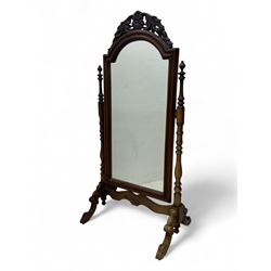 Late Victorian mahogany cheval mirror, arched frame with a pierced foliate crest, flanked ...