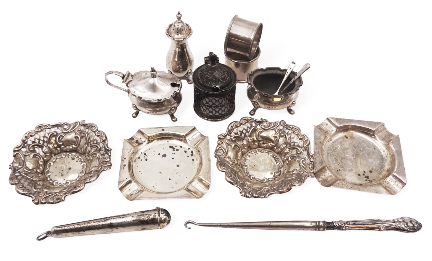 Group of silver, including silver handled button hook, cruet items, two ashtrays and two bon bon dishes, etc, all hallmarked 