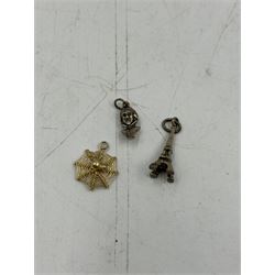 Two 9ct gold stone set rings, silver charm bracelet, two other bracelets and loose charms