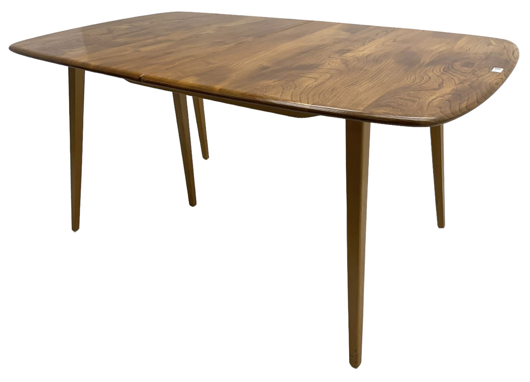 Ercol - light elm and beech 'Slide Leg Expanding Dining Table (444)', rectangular top with rounded corners, raised on tapered splayed supports, with two additional leaves