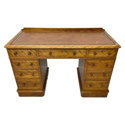 Victorian satin walnut twin pedestal desk, moulded rectangular top with rounded corners and raised back, inset leather writing surface with tooled borders, fitted with nine drawers with turned handles, on moulded plinth base 