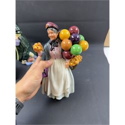 Four Royal Doulton figures, comprising The Parson's Daughter HN564, Dorothy HN3098, Christmas Parcels HN2851 and Biddy Pennyfarthing HN1843