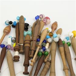 Collection of turned wooden lace maker's bobbins, including 19th century and later examples, mostly with glass spangles and turned shafts (100 approx)