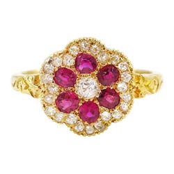 Early 20th century milgrain set, old cut diamond and oval cut ruby flower head cluster rin...