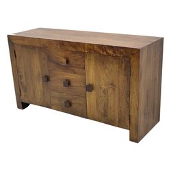 Contemporary Dakota mango wood sideboard, plain rectangular top over three central drawers flanked by cupboards with shelving, each with square pulls, raised on stile supports