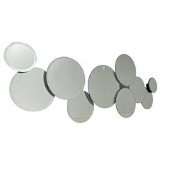 Contemporary abstract circular mirror, comprised of interconnecting bevelled plates of varying sizes