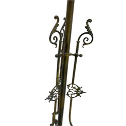 Victorian brass converted oil lamp stand, telescopic stem with scrolled uprights terminating to scrolled feet, dished base decorated with scrolling cast metal work and grotesque masks 